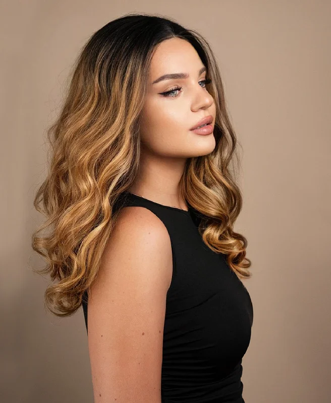 Lace wig with a 200 - density for a full and thick appearancelace front human wig - 18" rooted caramel bouncy curls.